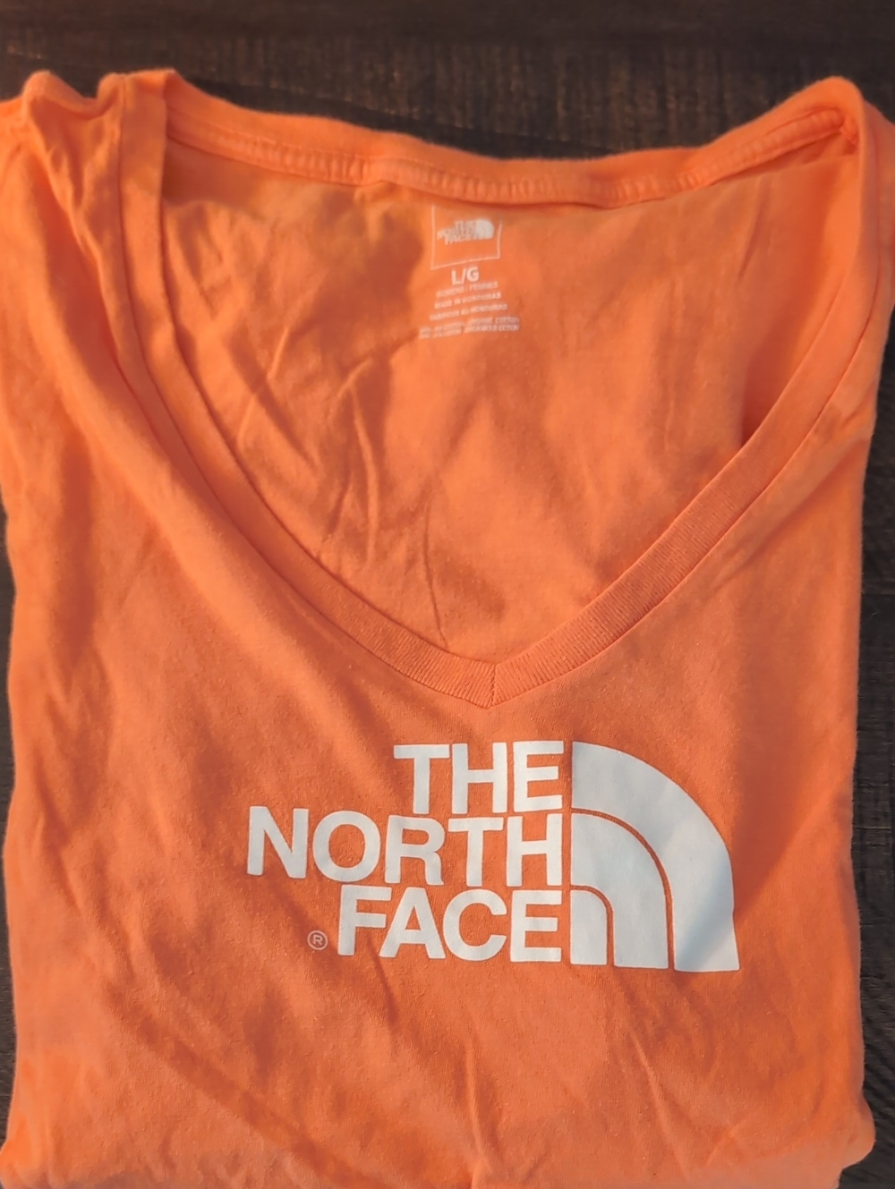 The North Face Orange V-Neck Tee with White Logo